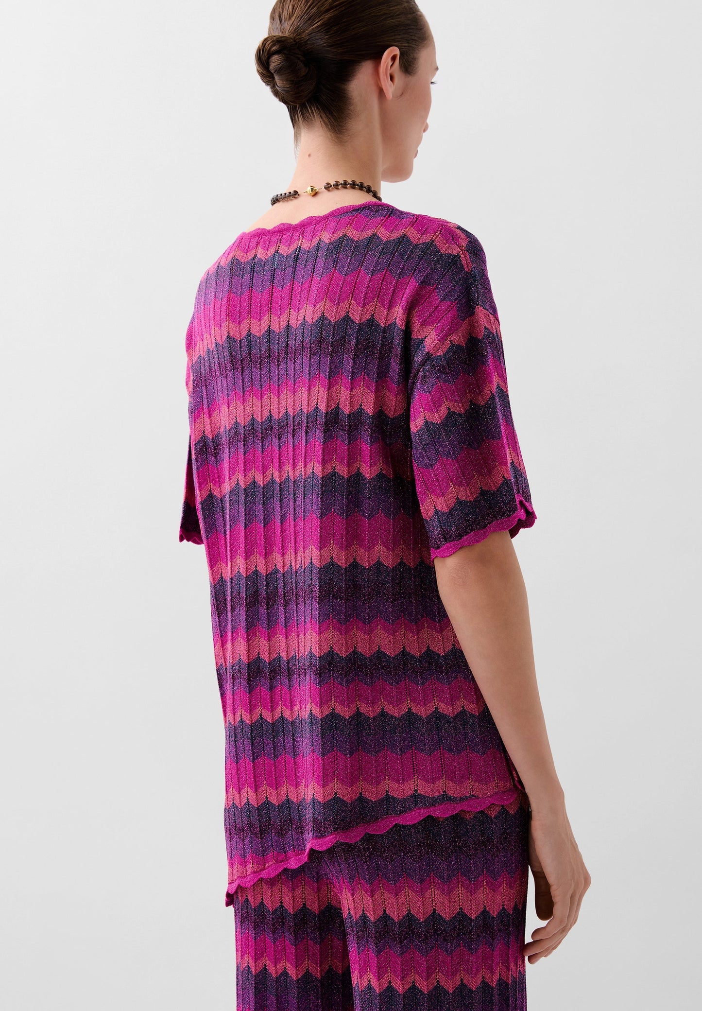 STRICKPULLOVER AUS LUREX MIT LOCHMUSTER
