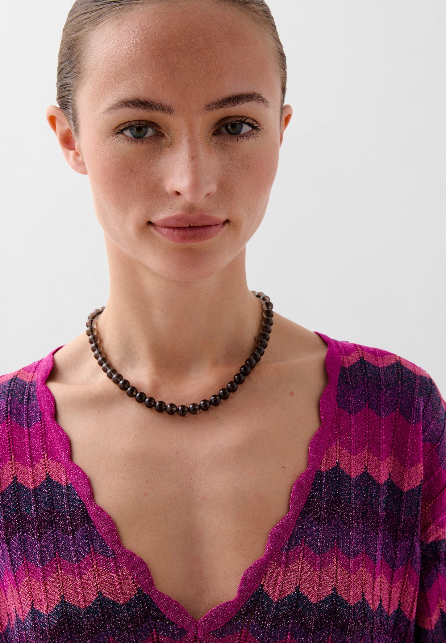 STRICKPULLOVER AUS LUREX MIT LOCHMUSTER